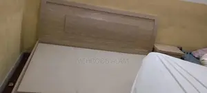 Photo - Double Bed Frame with Foam Mattress and Side Tables