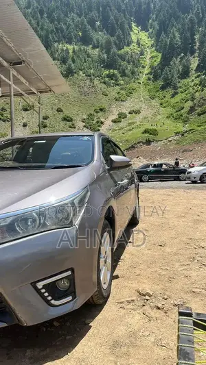 Photo - Toyota Corolla GLI Sedan - Well-Maintained Compact Car