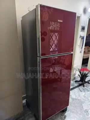 Photo - Full Size Haier Refrigerator - Clean and Functional