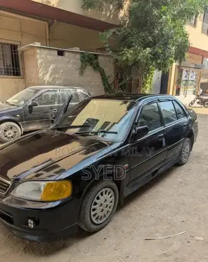 Photo - Honda City EXI Family Sedan - Reliable Compact Car