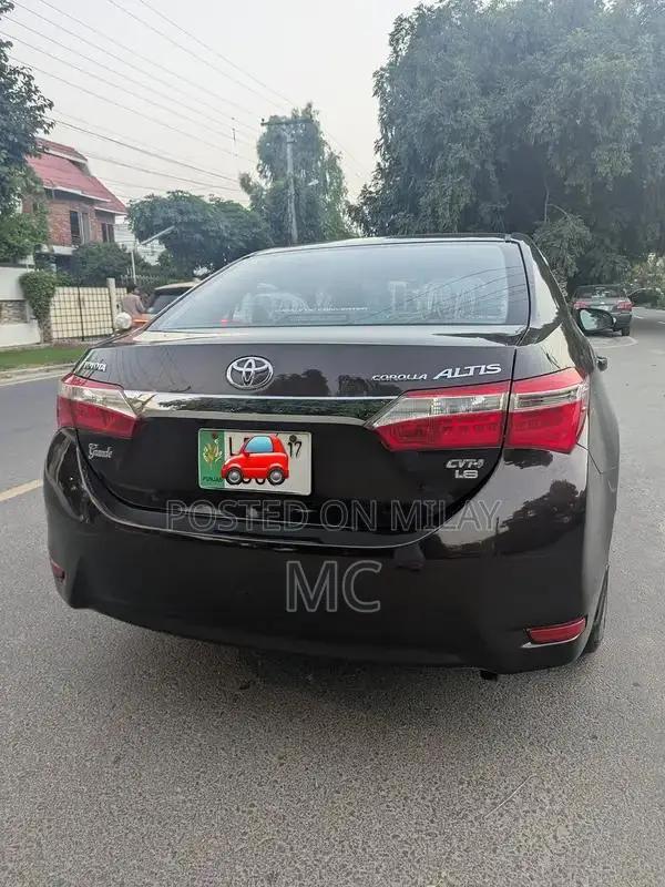 Toyota Corolla Altis Grande Sedan - Elegant Red Wine Luxury Model