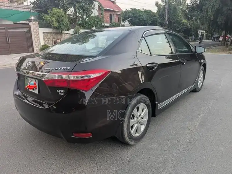 Toyota Corolla Altis Grande Sedan - Elegant Red Wine Luxury Model