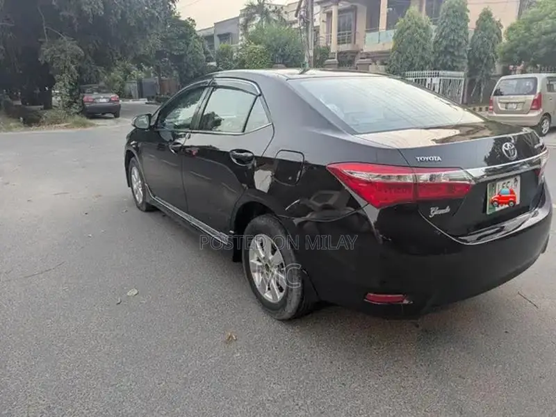 Toyota Corolla Altis Grande Sedan - Elegant Red Wine Luxury Model