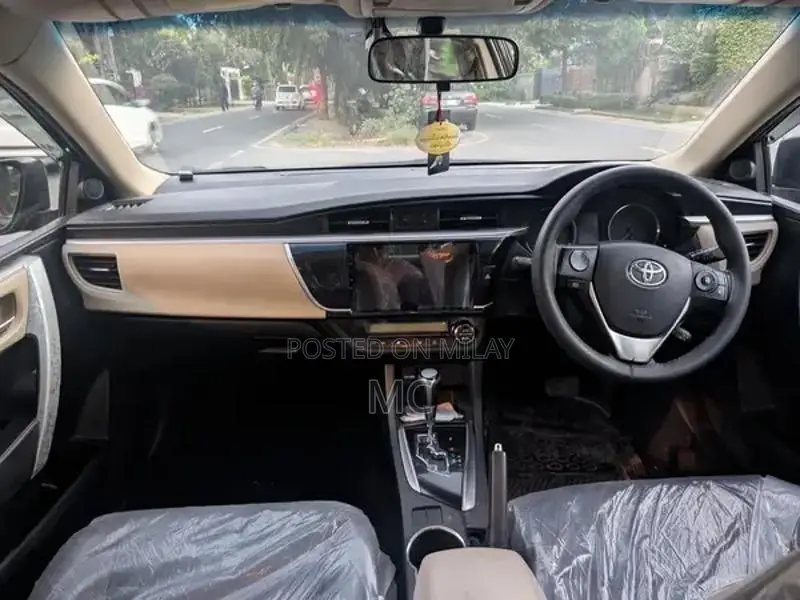 Toyota Corolla Altis Grande Sedan - Elegant Red Wine Luxury Model