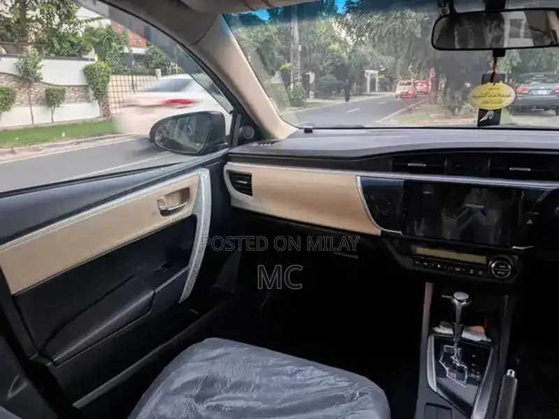 Toyota Corolla Altis Grande Sedan - Elegant Red Wine Luxury Model