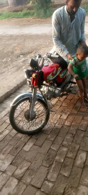 Photo - Honda 70cc Motorcycle - Compact Urban Commuter