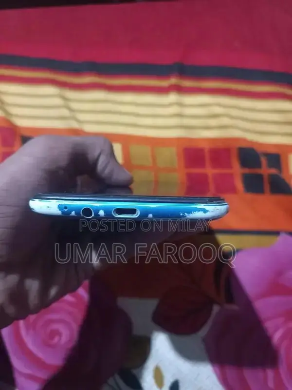 Compact Budget Smartphone with Dual Camera and Lightweight Design