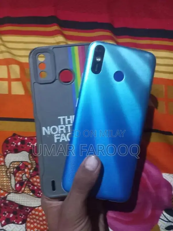 Compact Budget Smartphone with Dual Camera and Lightweight Design