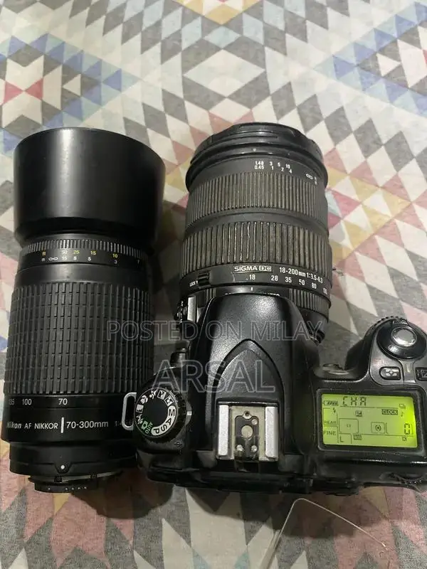 Nikkon Professional DSLR Camera with Multiple Lenses