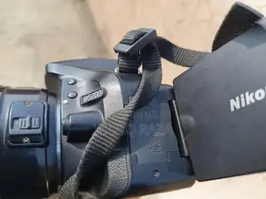 Photo - Nikon D5200 DSLR Camera with 50mm Lens and Accessories