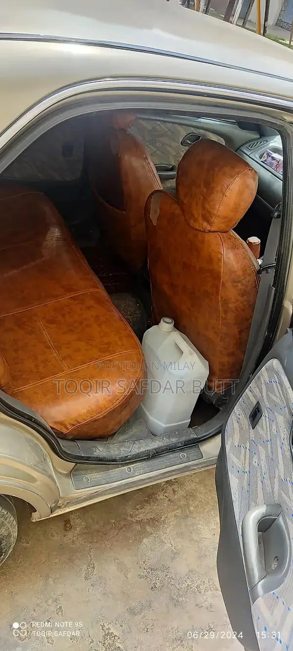 Suzuki Baleno 2005 Gold Sedan - Low Maintenance Family Car