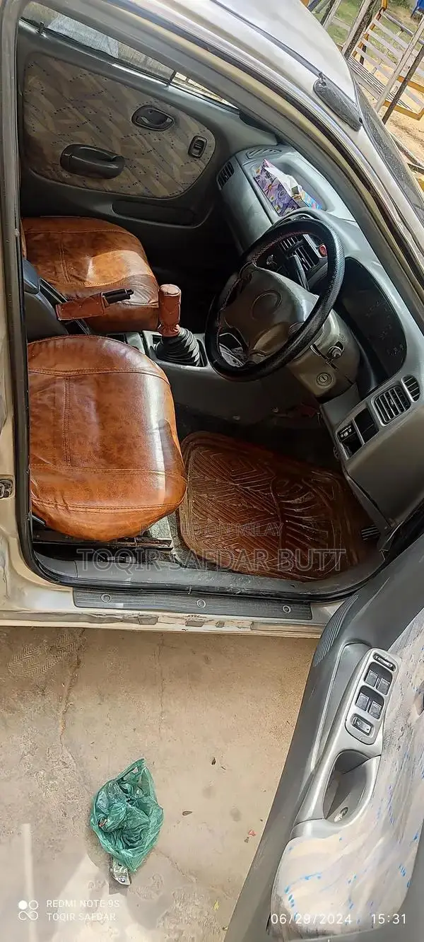 Suzuki Baleno 2005 Gold Sedan - Low Maintenance Family Car