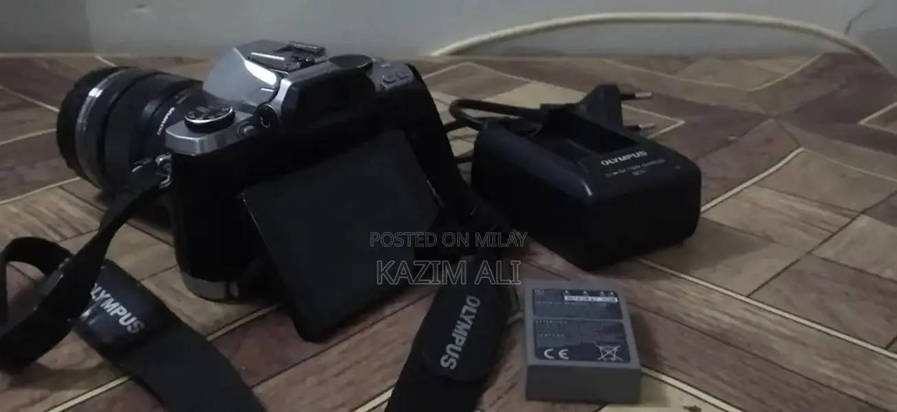 Olympus Digital Camera with Lens, Battery, and Charger