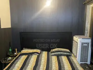 Photo - King Size Bed Frame - Spacious and Comfortable Sleeping Solution