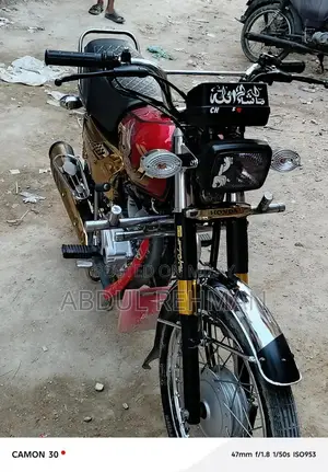 Photo - Honda 125cc Self-Start Motorcycle in Gold Finish