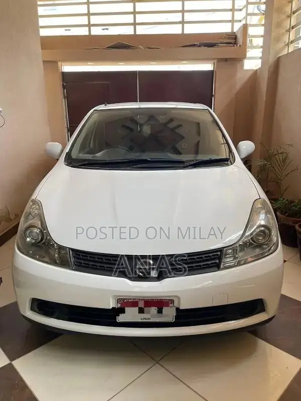 Nissan AD Compact Wagon - Well-Maintained White Sedan