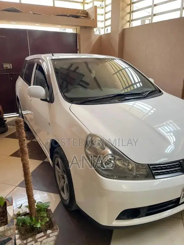 Nissan AD Compact Wagon - Well-Maintained White Sedan