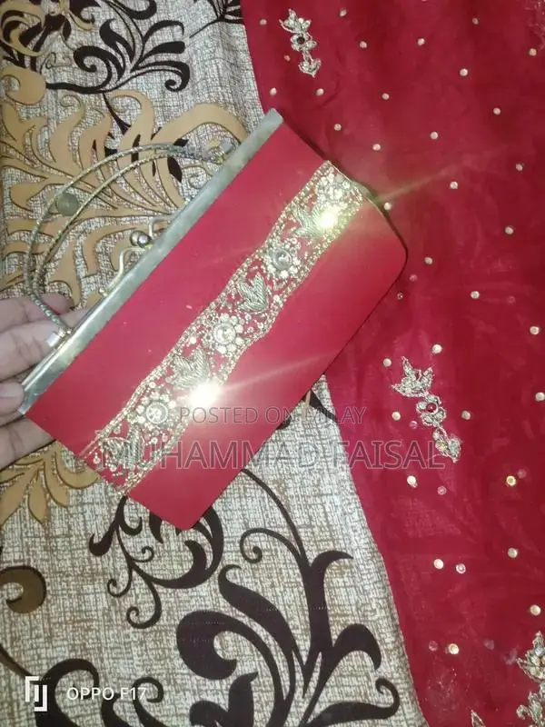 Embellished Red Bridal Lhanga Dress with Matching Pouch