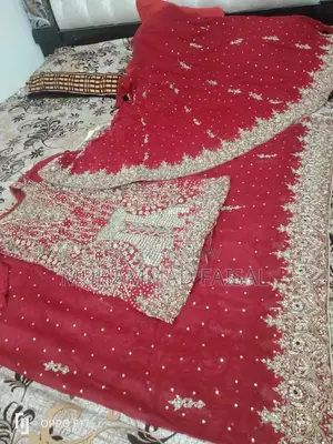 Embellished Red Bridal Lhanga Dress with Matching Pouch