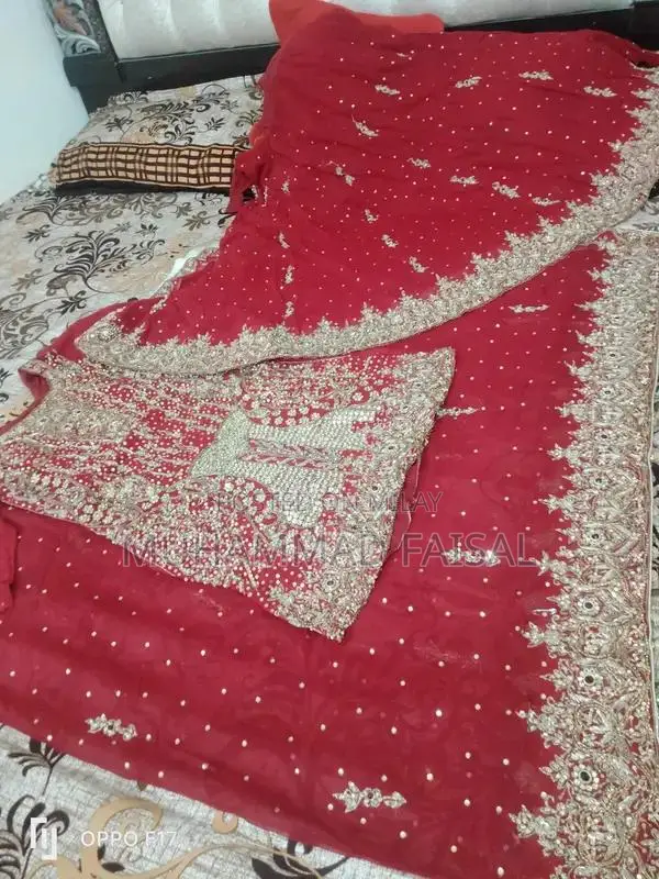 Embellished Red Bridal Lhanga Dress with Matching Pouch