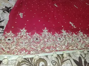 Embellished Red Bridal Lhanga Dress with Matching Pouch