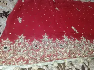 Embellished Red Bridal Lhanga Dress with Matching Pouch