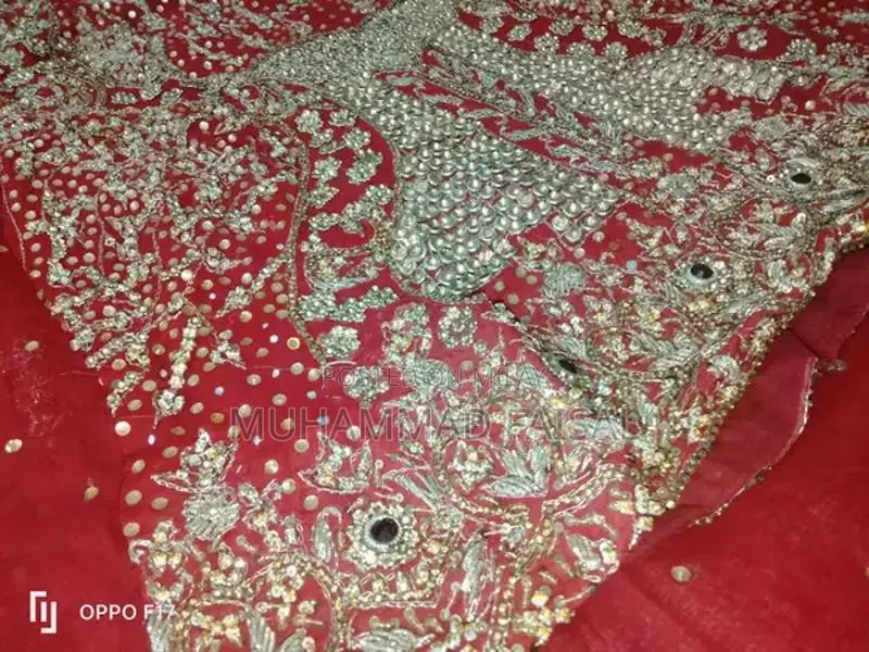 Embellished Red Bridal Lhanga Dress with Matching Pouch