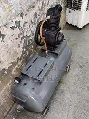 Large Air Compressor with Tank and Pipe