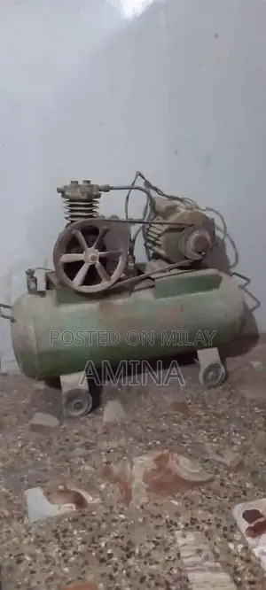 Large Air Compressor with Tank and Pipe