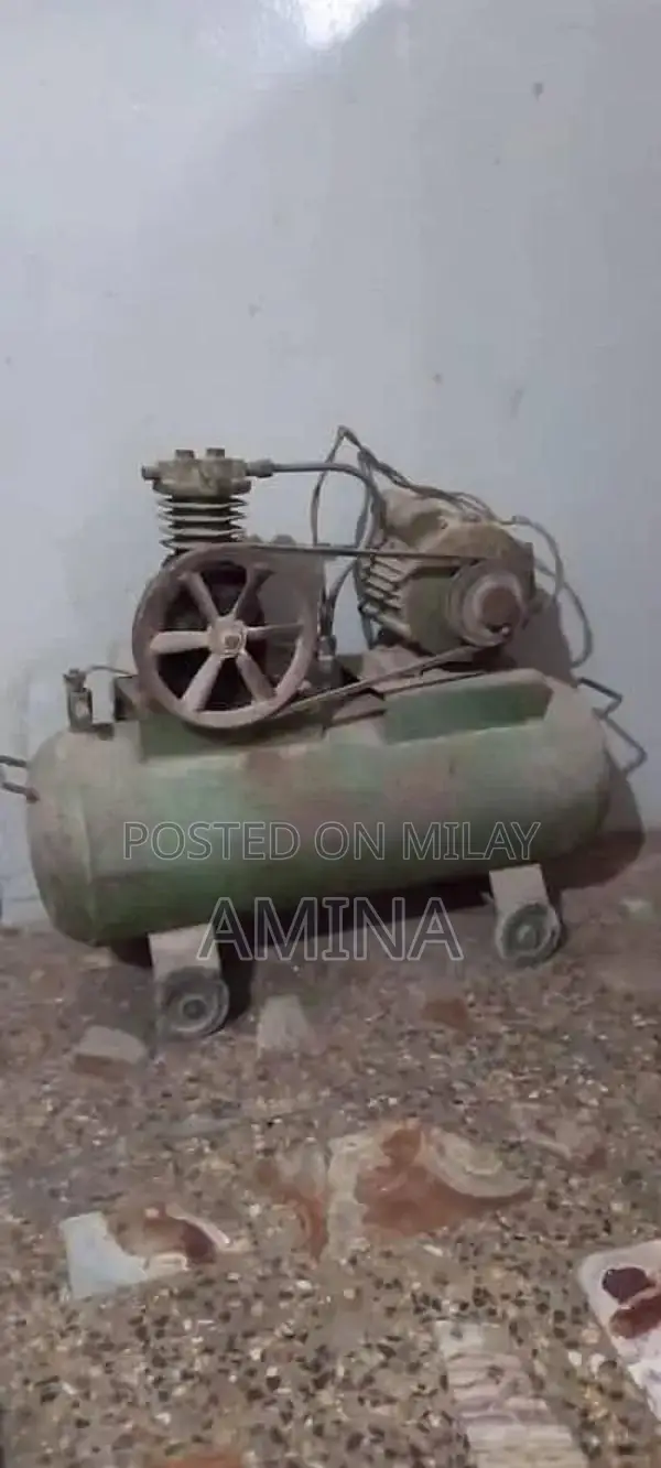 Large Air Compressor with Tank and Pipe