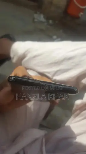 Damaged Sony Smartphone with Broken Panel and Back