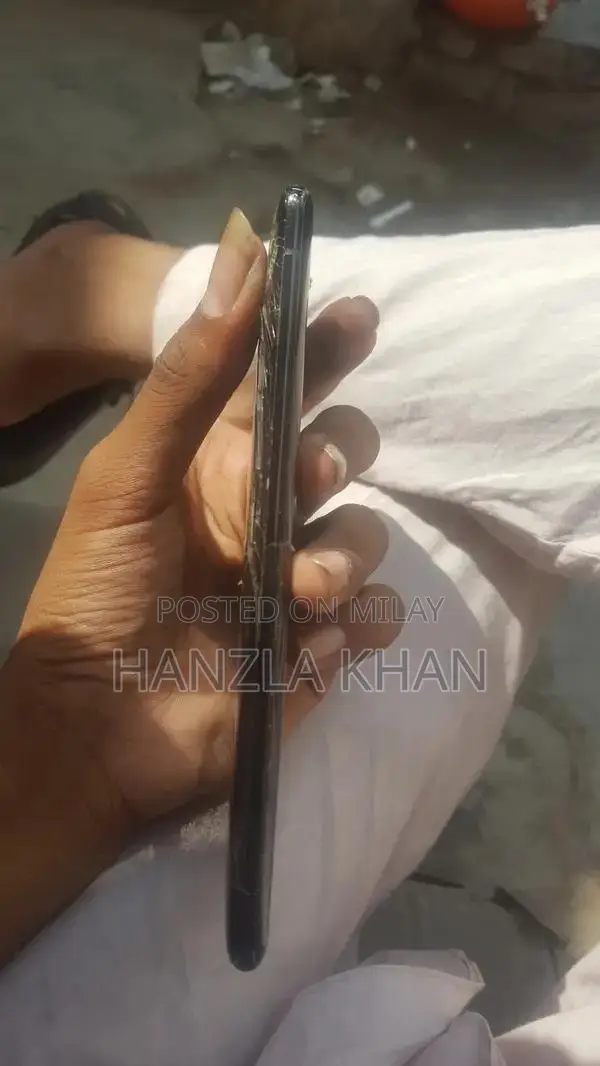 Damaged Sony Smartphone with Broken Panel and Back
