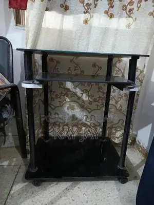 Photo - Portable Glass Laptop Table with Rollers for Home Office