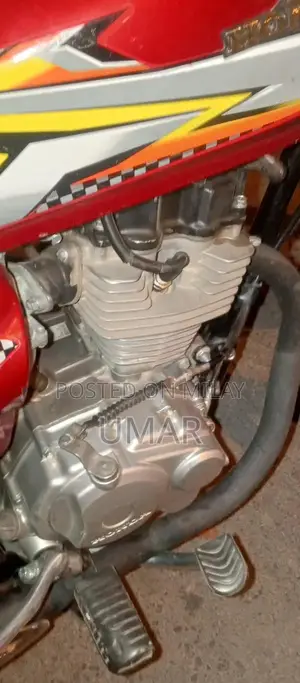 Photo - Red Bike with Lohar Number Paper