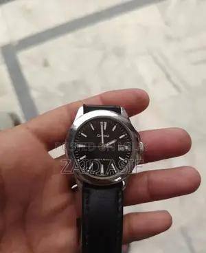 Casio Men's Quartz Watch with Black Dial and Leather Strap - MTP-1215