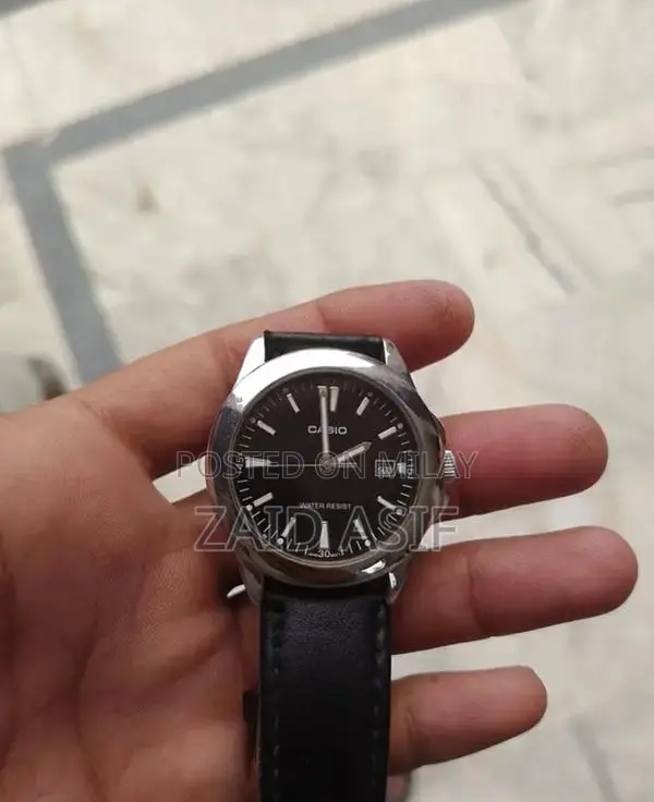 Casio Men's Quartz Watch with Black Dial and Leather Strap - MTP-1215