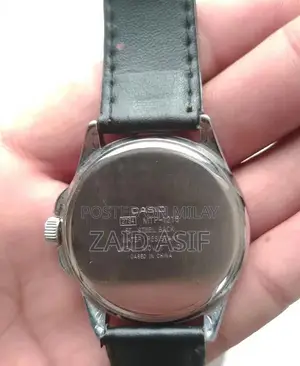 Casio Men's Quartz Watch with Black Dial and Leather Strap - MTP-1215