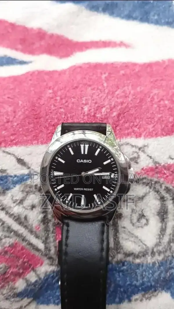 Casio Men's Quartz Watch with Black Dial and Leather Strap - MTP-1215