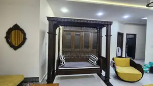 Wooden Swing with Striped Seat and Decorative Pillows