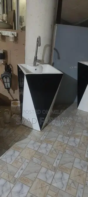 Photo - Fine Ceramic Bathroom Basin with Modern Faucet Design