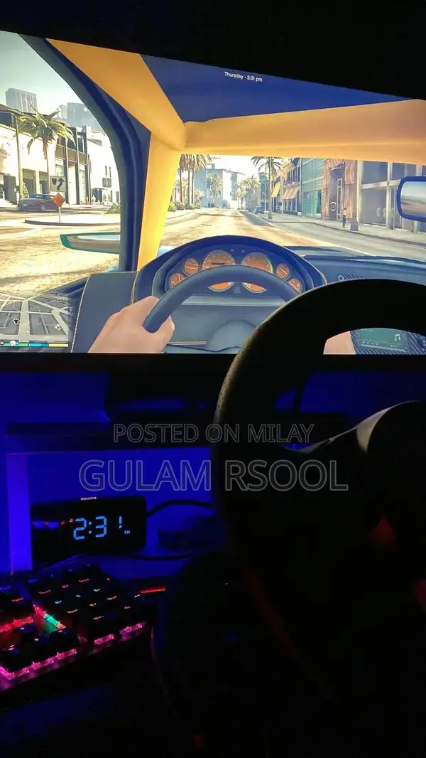 Complete Gaming PC Setup with Steering Wheel and Peripherals