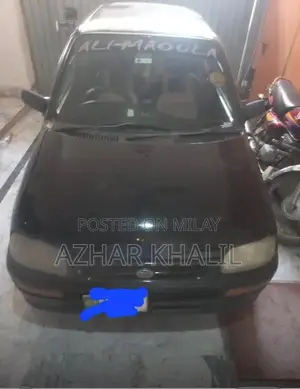 Photo - Couery Black Sedan - Versatile 4-Door Vehicle