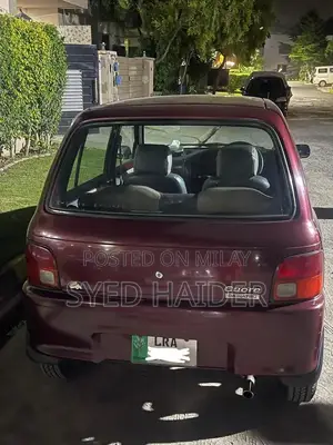 2001 Daihatsu Coure Hatchback - Well-Maintained Red Automatic