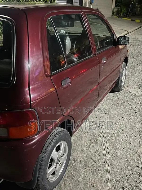 2001 Daihatsu Coure Hatchback - Well-Maintained Red Automatic
