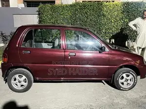 2001 Daihatsu Coure Hatchback - Well-Maintained Red Automatic