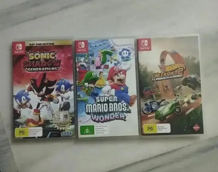 Nintendo Switch OLED Console with 3 Popular Games