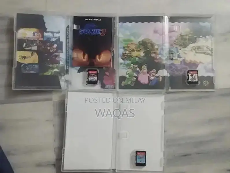 Nintendo Switch OLED Console with 3 Popular Games