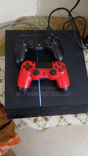 Photo - Sony PlayStation 4 Gaming Console with Dual Controllers