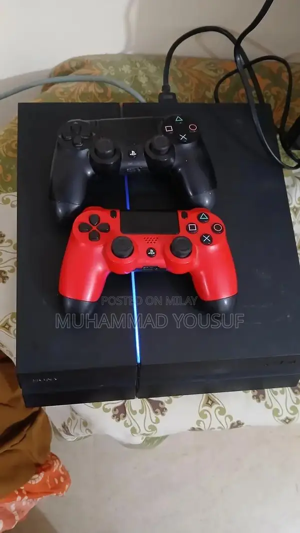 Sony PlayStation 4 Gaming Console with Dual Controllers