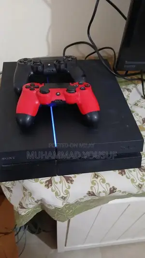Sony PlayStation 4 Gaming Console with Dual Controllers